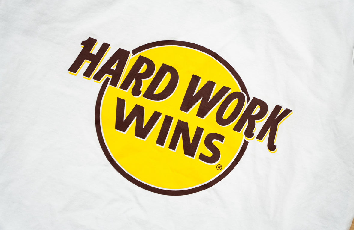 white HARD WORK WINS compression tank