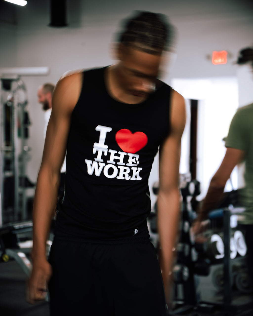 black “I ❤️ THE WORK” compression tank